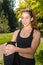 Cute young woman sporty girl with black top ,workout outdoor