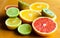 Cuted citrus fruits background. Mixed fruits background. Fruit salad