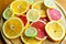 Cuted citrus fruits background. Mixed fruits background. Fruit salad