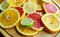 Cuted citrus fruits background. Mixed fruits background. Fruit salad