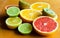 Cuted citrus fruits background. Mixed fruits background. Fruit salad