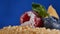 Cuted strawberry and blueberries on cake. The ignition spark on a children`s cake with strawberries and blueberries