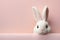 The cutest easter bunny, white fluffy rabbit, hare on pink background, pastel tones, cartoon, copy space