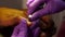 Cuticle circumcision on a afro man finger close-up using manicure tools in a beauty salon