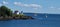 Cutler Island Lighthouse with sailboats floating by. Maine coast Camden