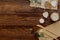 Cutlery with burlap and decorations. Rustic wedding set on wooden background.