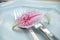 Cutlery on plate with lilium