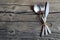 Cutlery set:fork,spoon and knife on rustic wooden table.Cutlery on old wooden background.Can be used as background menu for restau