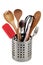 Cutlery in a steel drainer close-up on a white background