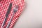 Cutlery table fork and knife on red tablecloth, top view, flat lay