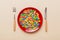 cutlery on table and sweet plate of candy. Health and obesity concept, top view on colored background