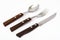 Cutlery with wooden handles on white background