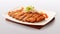 The cutlet is artistically sliced and elegantly presented on a rectangular ceramic plate with a distinct Japanese design