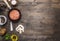 Cutlet of ground beef in a small frying pan, sliced mushrooms, pepper, herbs and salt border ,place text wooden rustic back