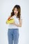  cutout studio shot Millennial Asian young happy surprise shocked female model in casual outfit standing smiling holding