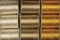 Cutout texture closeup on coils of colored sewing threads white,gold and yellow.