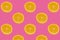 Cutted fresh lemons  on bright pink background