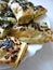 Cutted lavash pieces with vegetables. Burek with spinach and cheese and black cumin. Yufka