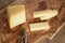 Cutted parmesan cheese on olive cutting board