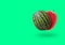 Cutted watermelon isolated on green pastel background with a shadow and copy space