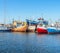 Cutter ships and sailboat standing in the harbour in DarÅ‚Ã³wko, Poland. Fishing boat in the dockyard and buildings od the