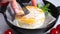 Cutting baked Camembert or Brie cheese with tomatoes