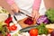 Cutting of beetroot with a knife, vegetable cutting in the kitchen