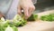 On a cutting board chef knife clean and chopped green bell pepper