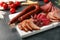 Cutting board with different sliced meat products served