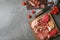 Cutting board with different sliced meat products on table