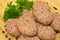 On cutting board homemade uncooked meatballs, kofte