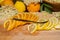 On a cutting board lie a sliced organic lemon and organic orange and a vanilla pod for the elderflower liqueur