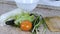 Cutting board, plate and vegetables: Chinese cabbage, cucumber, tomato, dill, green onion. Close up.