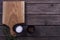 Cutting Board, rosemary and spices on a old wooden table. Copy space. Concept for restaraunt cafe bistro menu