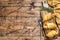 Cutting board with sausage rolls in the dough. wooden background. Top view. Copy space