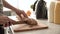 Cutting Bread On Wooden Board By Woman Hands Closeup