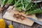 Cutting dandelion roots on a cutting board