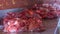 Cutting deer meat after hunting. Saddle of venison on steel table. Roe Deer - Wild Game Meat.