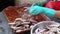 Cutting fish in market stall. Woman manual cleaning and cuts fresh fish