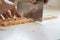 Cutting fresh homemade pasta dough to make vegan gnocchi