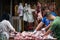 Cutting fresh meat on a market in Xian