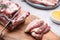 Cutting fresh pork fatback on grey table, closeup