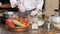 Cutting garlic with a sharp knife. The hands of the chef with a knife. Restaurant kitchen