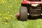 Cutting the grass of on a tractor lawn mower