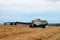 Cutting hay the combine on field  in the summertime