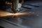 Cutting of metal. Sparks fly from laser