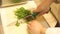 Cutting parsley in restaurant