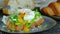 Cutting a poached egg with fork, runny egg yolk on toast, avocado sandwich, close-up video, high quality 4k horizontal