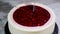 Cutting raspberry cream mousse cake. Raspberry cake.