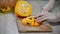 Cutting raw pumpkin slice. Woman cutting orange pumpkin piece.Raw pumpkin cut